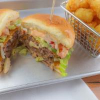 The Kick Ass Beef Burger · Double patty, brioche bun, cheese, lettuce, tomato, pickles, onions, TM secret sauce and fri...