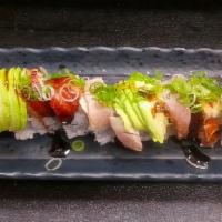 White Dragon · Shrimp tempura, white tuna, unagi, avocado, green onion.