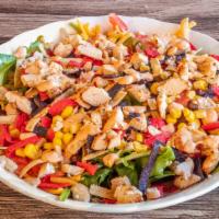 Southwest Chicken Salad · Spring mix with grilled chicken breast, tortilla strips, green onion, black beans, corn, tom...