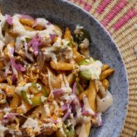 STREET 'KALYE' FRIES · House-cut fries, tito's all purpose sauce, caramelized onions, pickled jalapenos & red onions