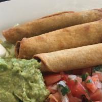 Taquitos · Three corn tortillas rolled and filled with shredded beef or chicken, fried and sawed with o...