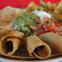 Fiesta Platter · A sample platter of taquitos, nachos, and quesadilla. Served with our homemade guacamole, so...