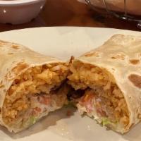 Super Burrito · Flour tortilla filled with refried beans, rice, lettuce, cheese, sour cream, and tomato. Pro...