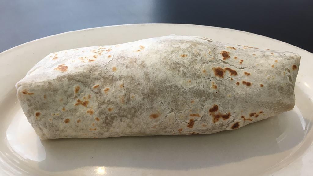 Azteca Super Burrito · Flour tortilla filled with whole  beans, rice, pico de gallo, sour cream .  Protein choice of ground beef, shredded beef, pork chile verde, carne asada, carnitas, chicken, and shrimp.