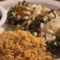 Tres Tacos · Three mini traditional soft tacos. Small corn tortillas served with your choice of Protein; ...