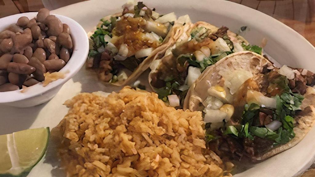 Tres Tacos · Three mini traditional soft tacos. Small corn tortillas served with your choice of Protein; topped with onions, cilantro, and our homemade salsita.