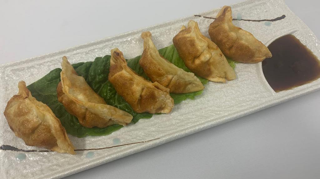 Gyoza · 6 pieces of pan fried potstickers.