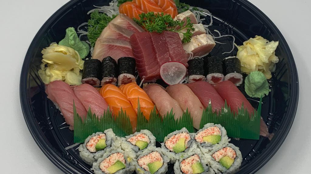 Sushi & Sashimi Deluxe · 8 pieces Assorted Nigiri, 12 pieces Assorted Sashimi, Tekka Maki & California Roll.