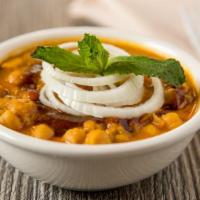 51. Chana Masala · Garbanzo beans cooked in spices.