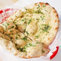 Garlic Naan · Leavened bread cooked with fresh garlic.