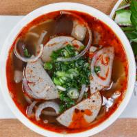 5. Bun Bo Hue · Thinly sliced beef brisket and pork cake in homemade spicy hue-style broth with round rice n...