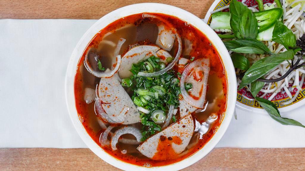 5. Bun Bo Hue · Thinly sliced beef brisket and pork cake in homemade spicy hue-style broth with round rice noodle.