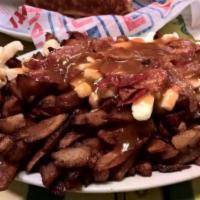 Bacon Poutine · Our signature steak cut fries, tossed with white cheddar cheese curds and drowned in our cla...