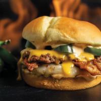 Fiery Bacon Burger · Two beef patties cooked-to-order, topped with Texas Pete seasoned bacon, Pepper Jack cheese,...