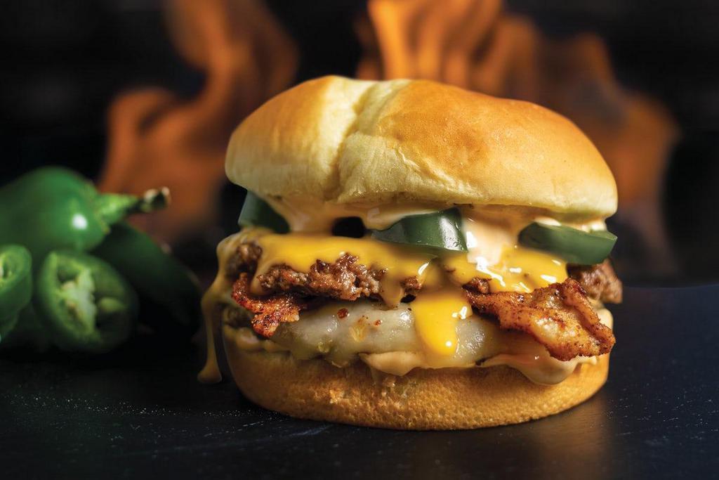 Fiery Bacon Burger · Two beef patties cooked-to-order, topped with Texas Pete seasoned bacon, Pepper Jack cheese, cheese sauce, jalapeños, and chipotle mayo.