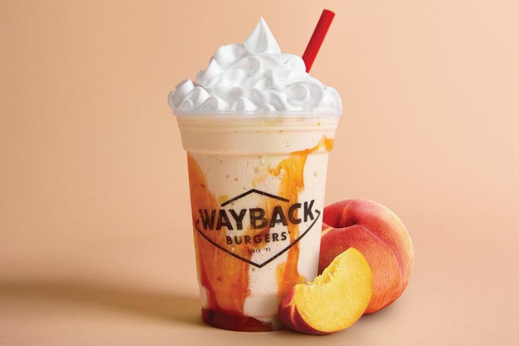 Peach Milkshake · Hand-dipped vanilla milkshake perfectly blended with a peachy swirl and topped with whipped cream.
