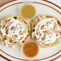 Sopes · Choice of meat, with fried beans, cheese, lettuce, pico de gallo, sour cream and salsa.