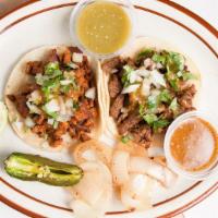 Regular Taco · Choice of meat with onions, cilantro and salsa.