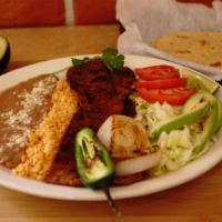 Carne Asada · Delicious strips of steak meat served with rice, beans,  and choice of flour or corn tortill...