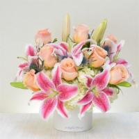 MD12 – The Luxe Bouquet · Beautiful fragrant stargazer lilies and premium roses are all designed in a white cylinder c...