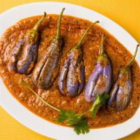 Bagara Baingan · Egg plant pieces cooked with peanut sauce, Sesame and coconut with mixed spices.