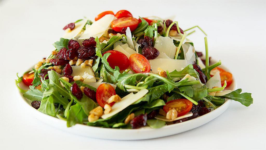 Spring Salad · Spinach, arugula, dried cranberry, walnut, parmesan cheese, and balsamic vinaigrette sauce.