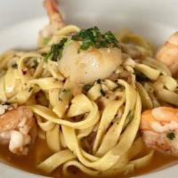 Fettucine alla Zingara · Gluten-free option. prawns fettucine, seared scallops, garlic, white wine, lemon, caper, cal...
