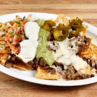 Regular Nachos · Choice of meat, choice of beans, cheese, pico de gallo and jalapenos.