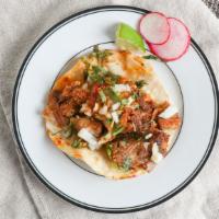 Soft Taco · Choice of meat, cilantro, onions and spicy tomatillo salsa.