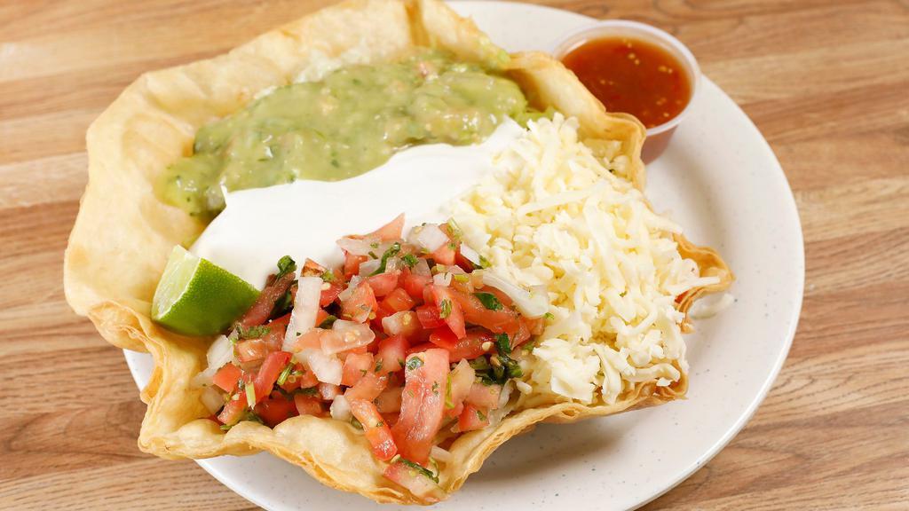 Taco Salad · Choice of Meat, Rice, beans, sour cream, cheese, guacamole, lettuce, and salsa