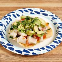 Fish Ceviche · Tilapia marinated in lemon-lime juice, pico de gallo and topped with avocado.