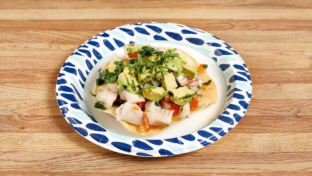 Fish Ceviche · Tilapia marinated in lemon-lime juice, pico de gallo and topped with avocado.