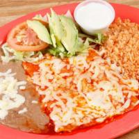 Enchiladas · 3 enchiladas stuffed with choice of meat, topped with melted cheese and red enchilada sauce.