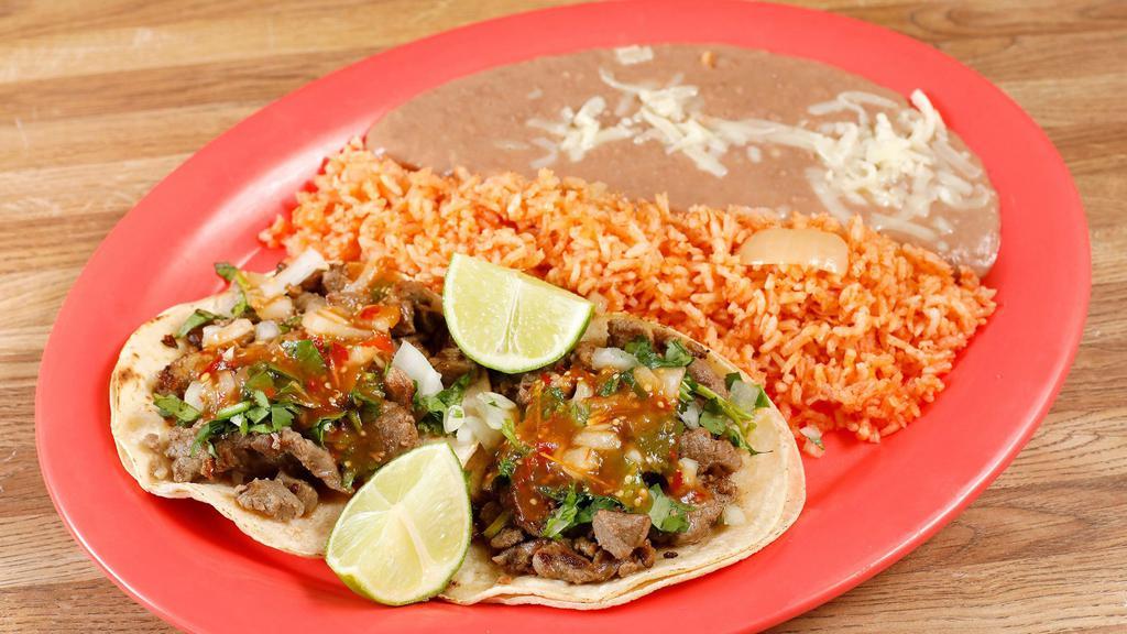 Taco Plate · 2 tacos choice of beans and rice