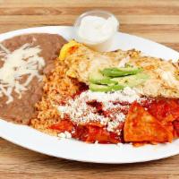 Chilaquiles · Deep fried chips topped with our In- House Red Salsa and eggs. Lettuce, tomatoes, avocado, s...