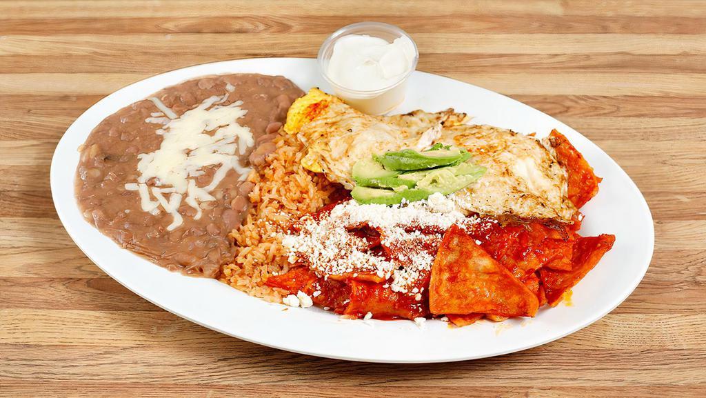 Chilaquiles · Deep fried chips topped with our In- House Red Salsa and eggs. Lettuce, tomatoes, avocado, sour cream, and corn tortillas.