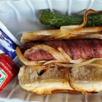 Mission DoG · Bacon wrapped hotdog, topped with grilled onions and serrano peppers.