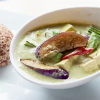 Green Curry · Green curry with zucchini, bamboo shoots, bell peppers green beans, and coconut milk.  Spicy...