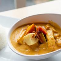 Yellow Curry · Mild yellow curry with potatoes, carrots, onions, and coconut milk. Option for vegan with to...