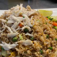 Crab Fried Rice · Pan fried jasmine rice with crab, garlic, egg, peas, carrots, and green onions. Flavorings w...