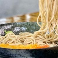 Zaru Soba · Cold buckwheat noodles topped with shredded seaweed alongside a dipping sauce and shrimp tem...
