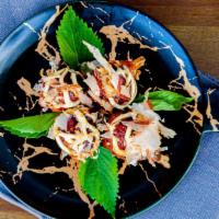 Takoyaki · 6 battered octopus topped with kewpie mayo, special sauce, & bonito flakes