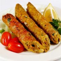 Chicken Seekh Kebab · Two pieces. Ground chicken marinated in spices on skewers and cooked in clay oven.