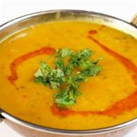 Daal Saag · Daal cooked with spices and lentils.