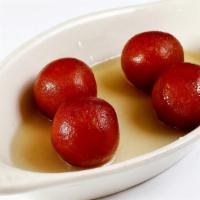Gulab Jamun · Fried cottage cheese soaked in sweet syrup.