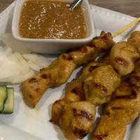 Satay Chicken / Beef · Marinated chicken or beef barbecued on skewers served with a peanut sauce.