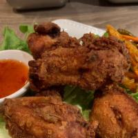 Chicken Wings · Deep fried chicken wings marinated and served with special plum sauce.