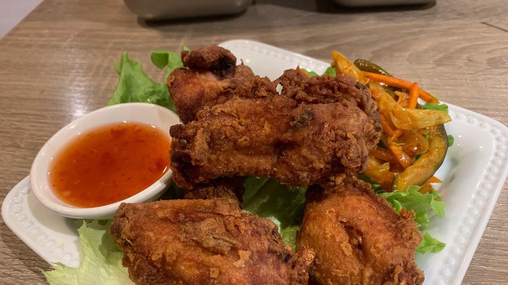 Chicken Wings · Deep fried chicken wings marinated and served with special plum sauce.