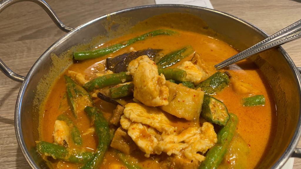 Red Curry Chicken · Spicy. Serving potatoes, eggplants, okra and string beans.