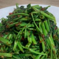 Kang Kung Belachan · Sautéed water spinach with garlic, onions, and Malaysia shrimps paste sauce.
